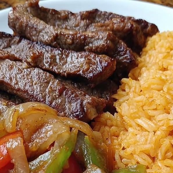 Pepper Steak with Onions and Yellow Rice